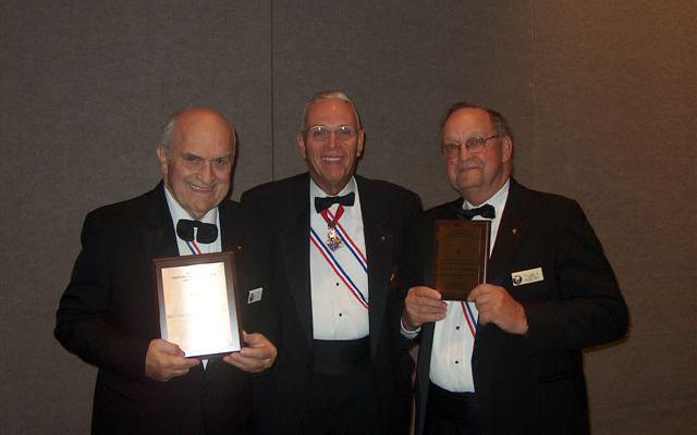 Virgil Meyer and Carl Koors accept awards at Hennepin Province Banquet